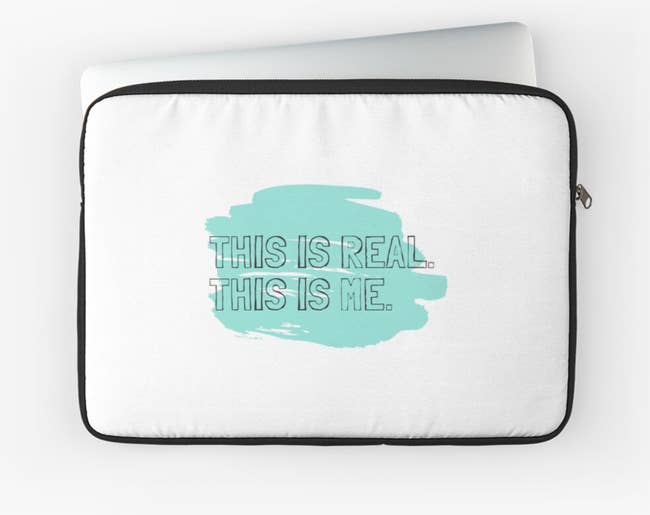 white laptop case with block texts that reads this is real this me with turquoise behind it