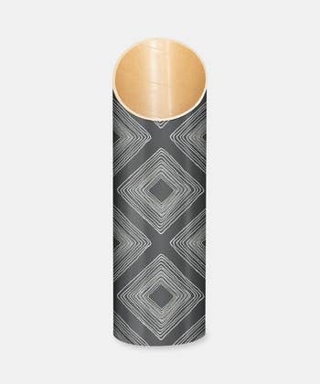 a gray tube with a geometric print 