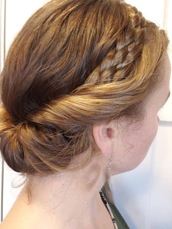 Reviewer with braided updo hairstyle, viewed from the side