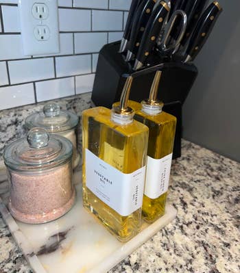 reviewer's room countertop with weapon artifact set, pinkish Himalayan brackish successful lidded jars, and 2 of the narrowm labeled rootlike lipid bottles with stainless alloy pumps