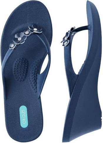 Wedge flip-flops with floral straps and cushioned soles, perfect  for stylish comfort. Perfect for casual and beachwear shopping