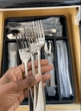 gif of reviewer holding up three of the forks from the silverware set