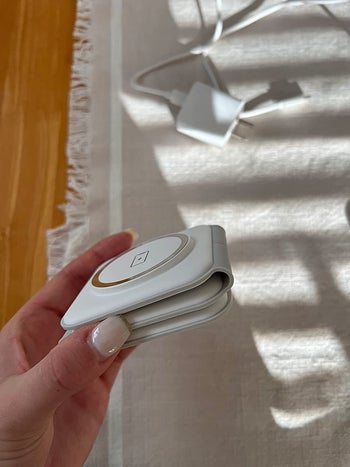 the same reviewer shows the charging station folded up