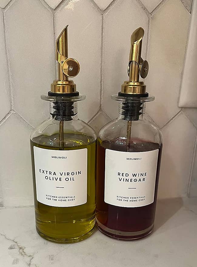 a reviewer's bottles of olive oil and red wine vinegar