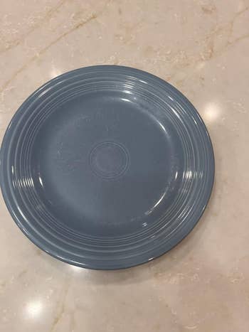 Round ceramic meal  sheet  with a elemental  ridged design