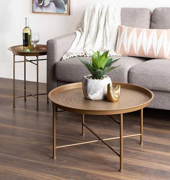the gold coffee table with a matching gold end table