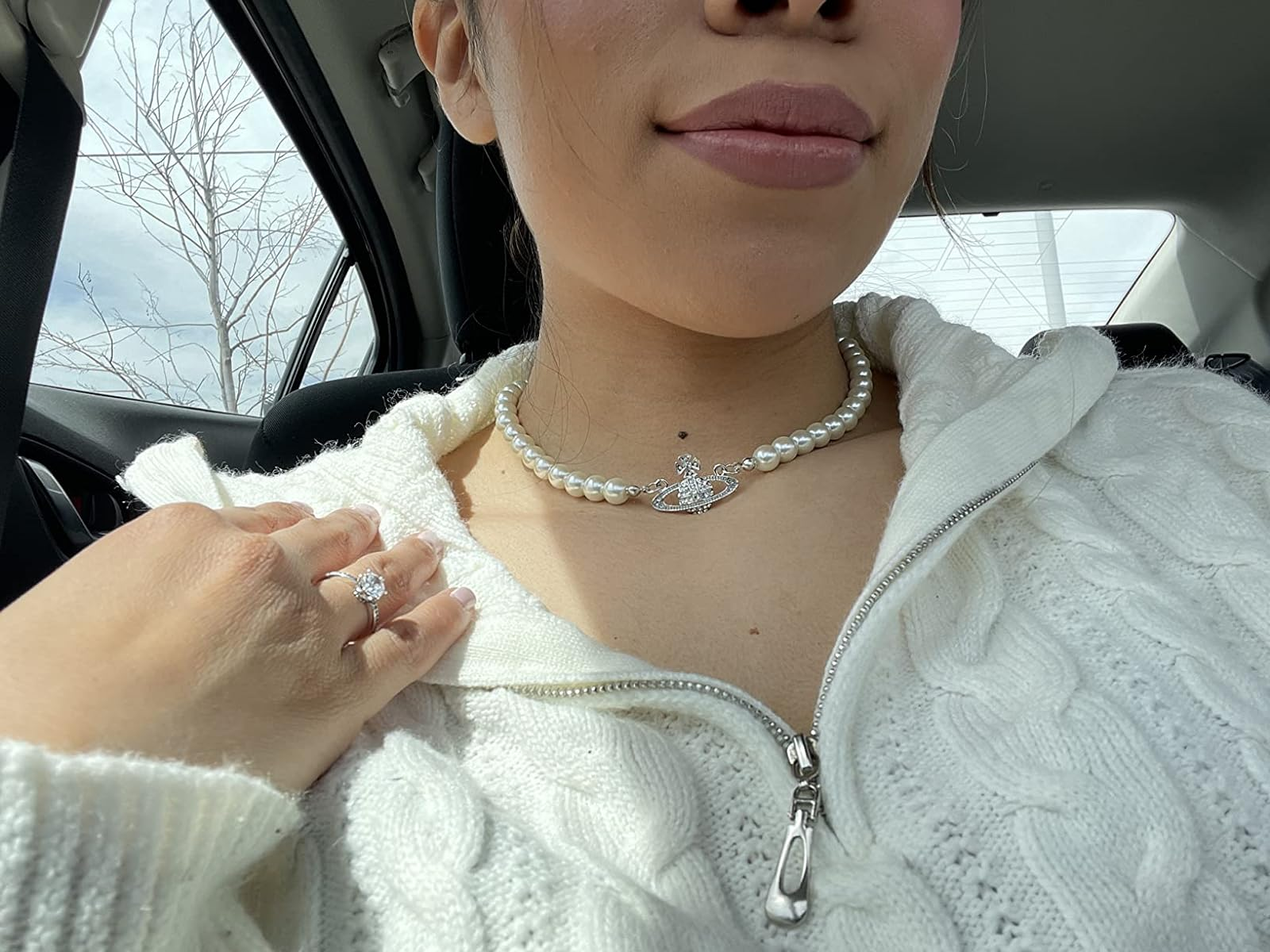 reviewer wearing the silver necklace