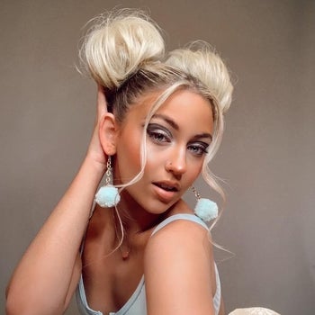 a different model wearing blonde space buns