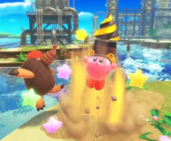a screenshot from the game of Kirby bursting from the ground with a drill attachment 