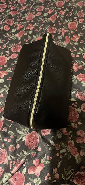reviewer photo of the black bag zipped shut