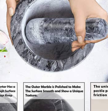 overhead shot of hands holding the black mortar and pestle