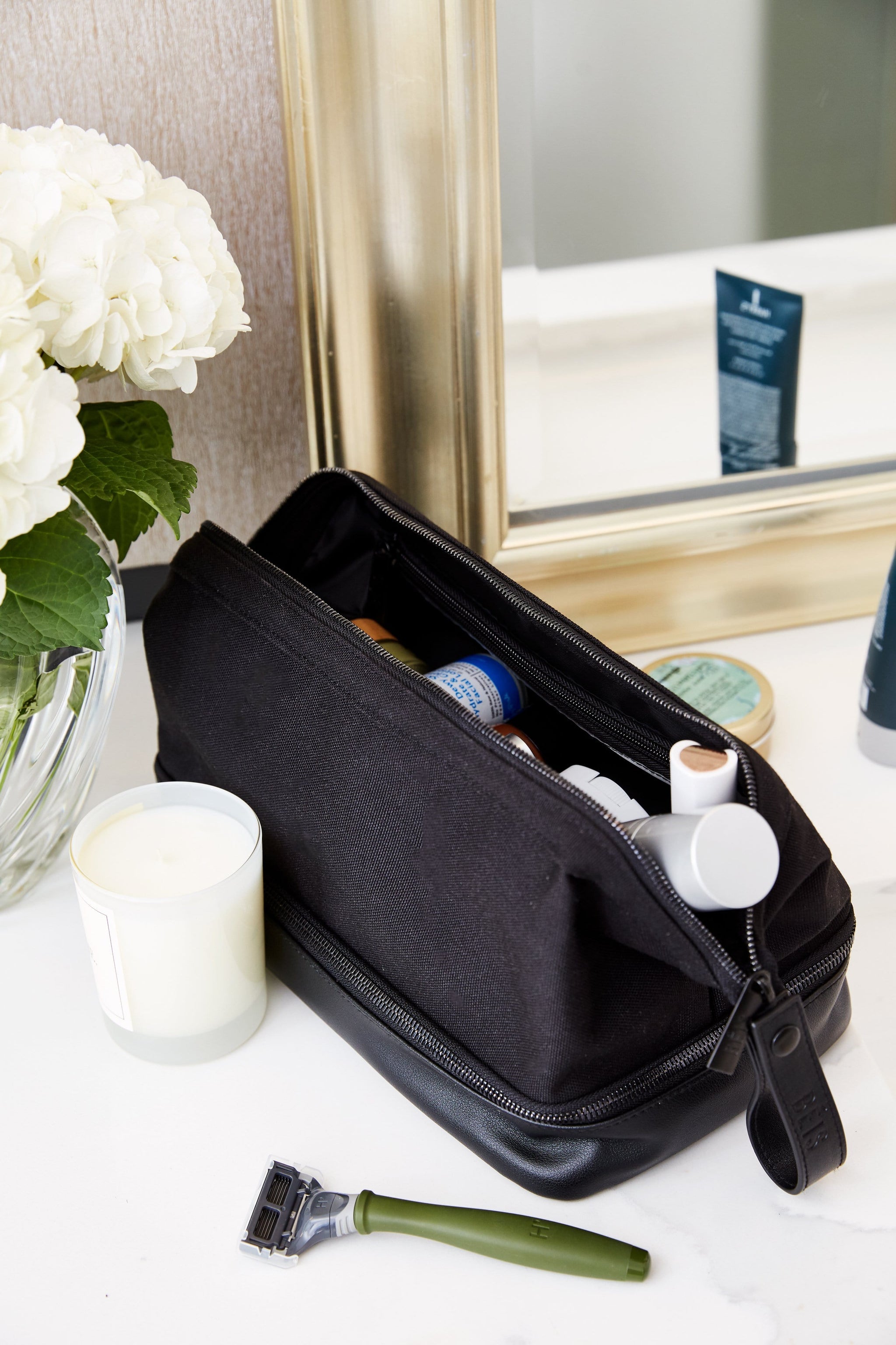 black dopp kit on bathroom counter
