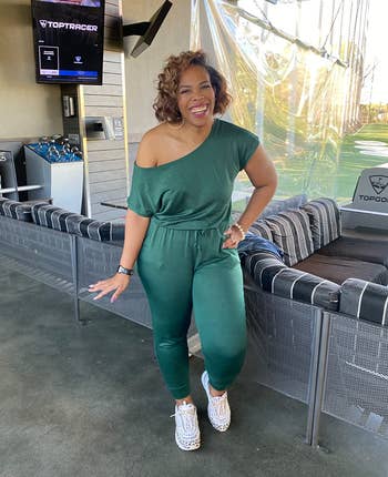 Reviewer wearing the same jumpsuit in green