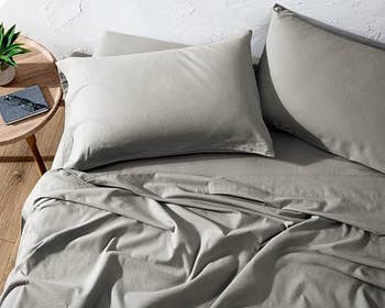 the airy  grey flannel sheets and pillowcases connected  a bed