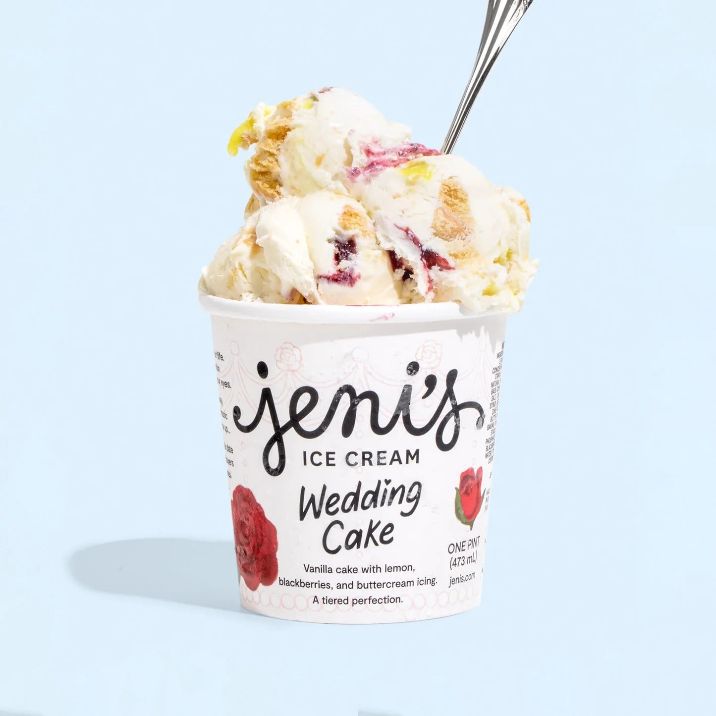 a pint of wedding cake ice cream with a spook stuck in it
