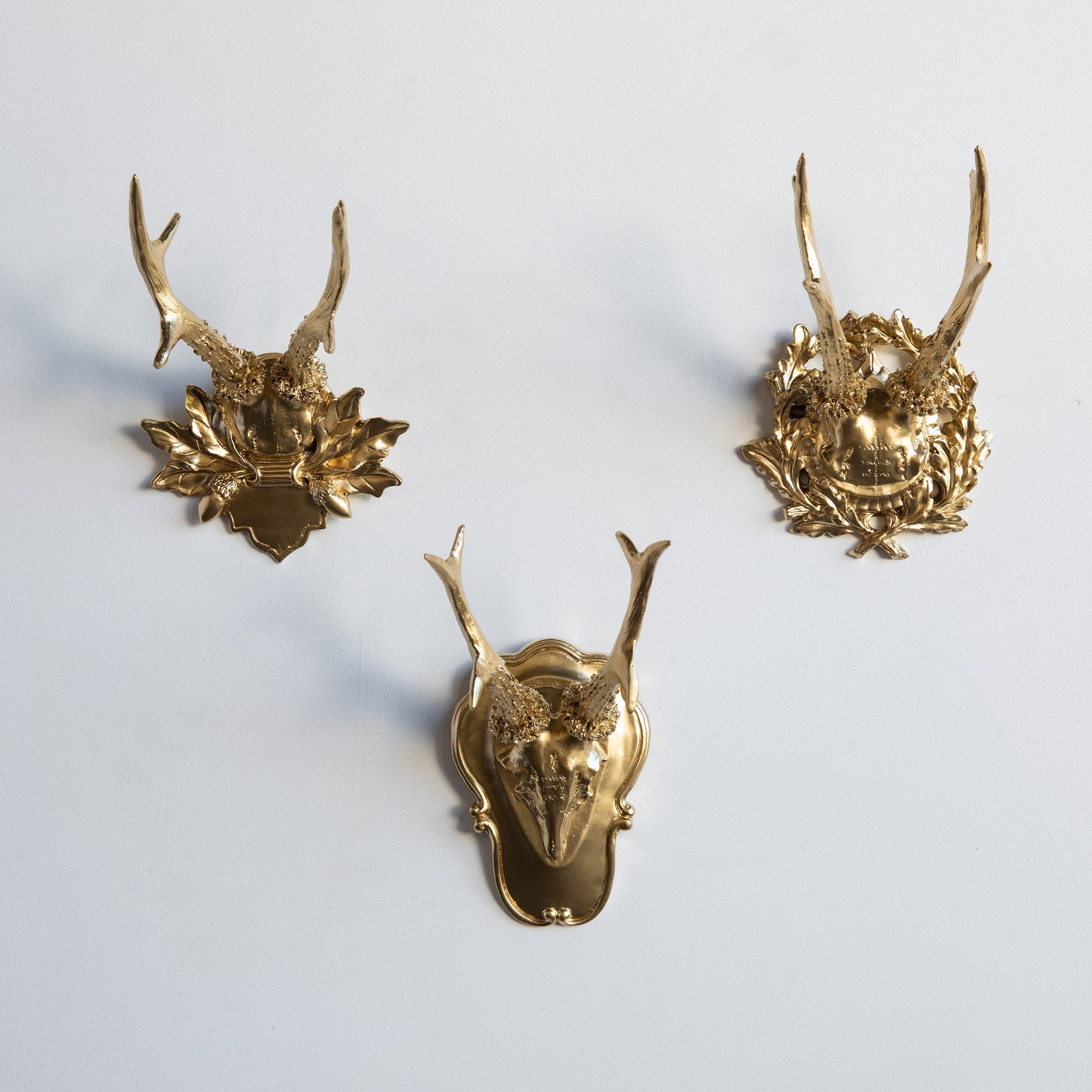 three faux gold deer antlers