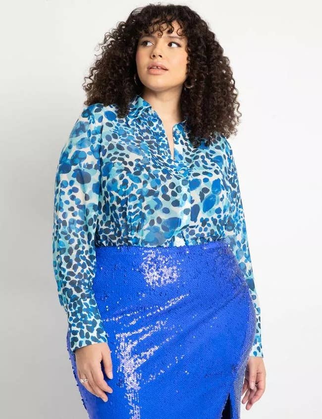 model wearing the sheer blue pattern blouse