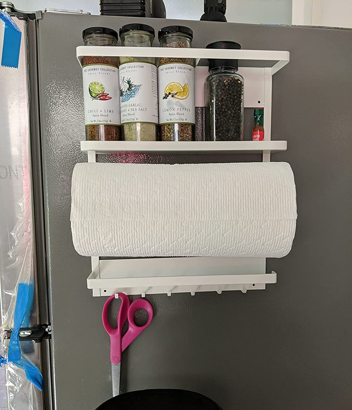reviewer image of the kitchen organizer on the side of a fridge