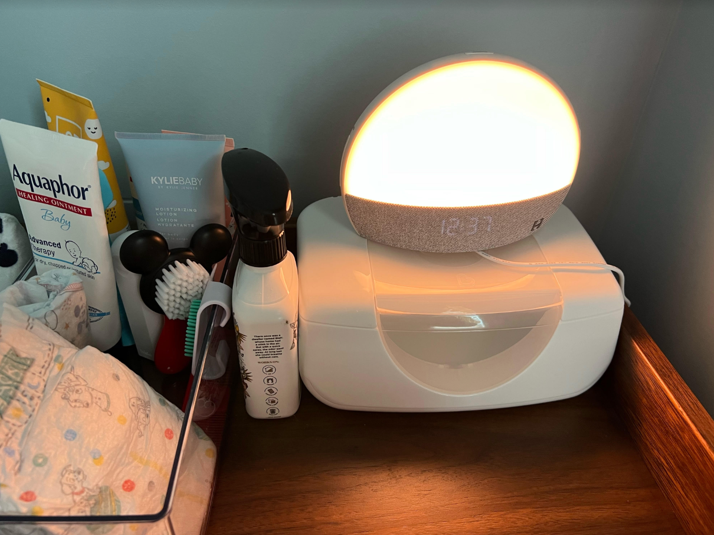 the Hatch Restore sound machine/night light on dresser in baby's room