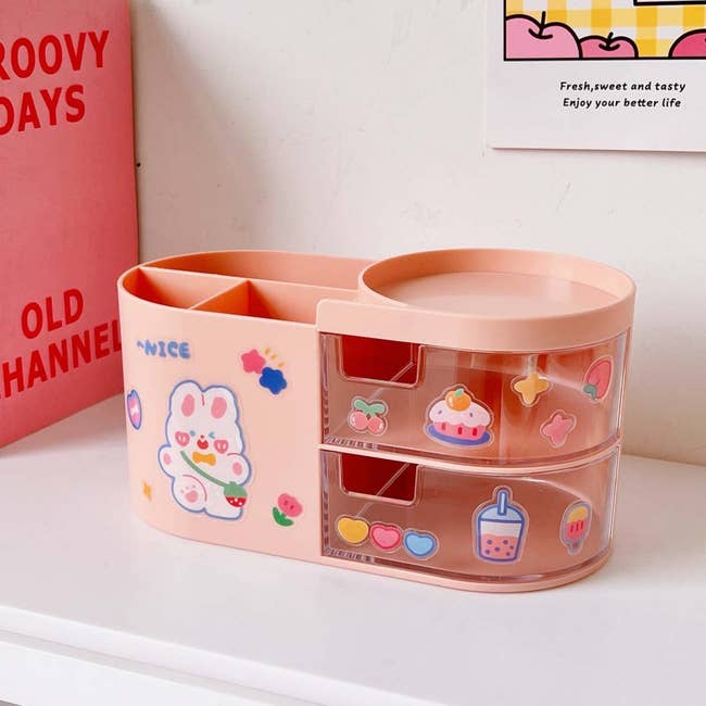 pink organizer with bunny, star, heart, and cupcake decals