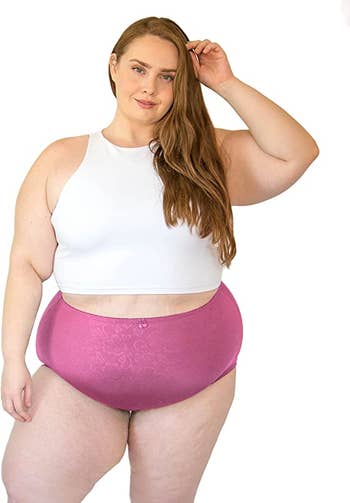 model wearing pink silky underwear with floral pattern