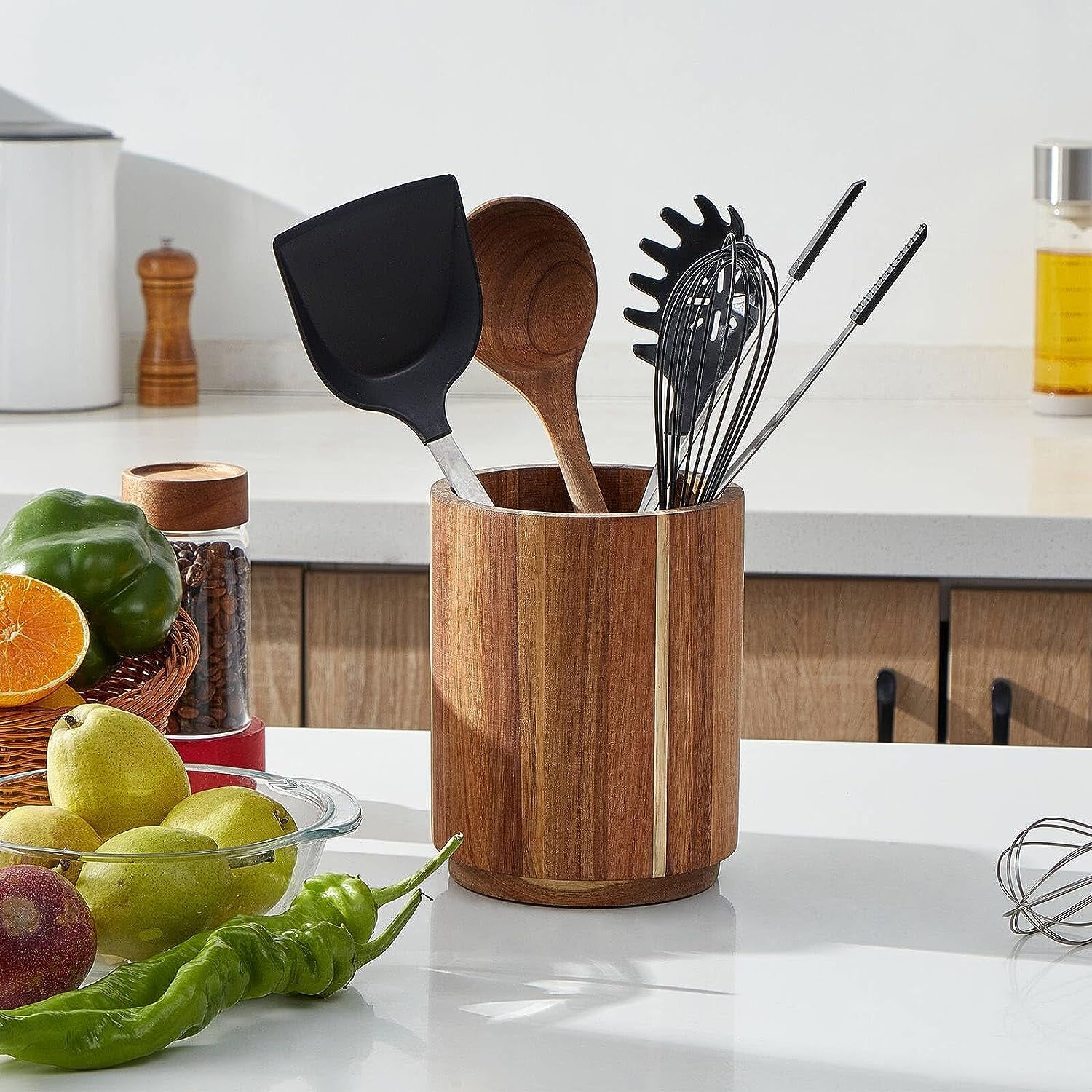 kitchen utensils in a wood crock