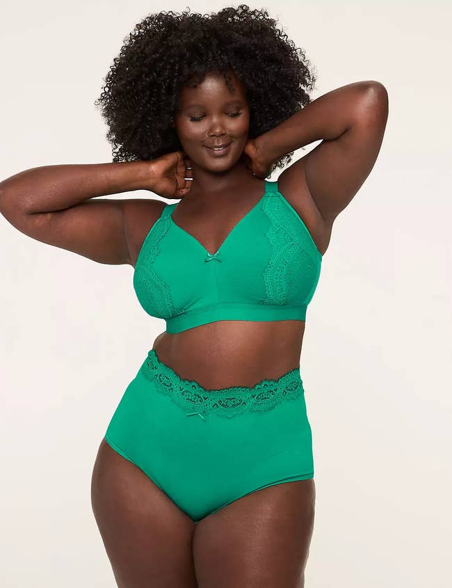 Person modeling a lace-accented lingerie set, showcasing comfortableness  and style
