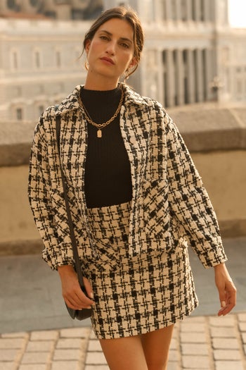 model wearing black and white houndstooth shacket