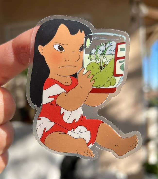 a sticker of lilo shaking her makeshift dolls in a pickle jar