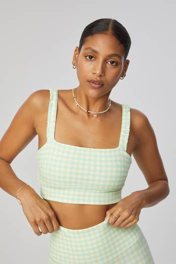 another model posing in the green gingham print bra