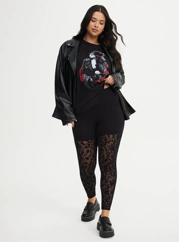 Person successful  a graphic tee, leather jacket, and patterned leggings, with loafers. Fashionable casual outfit