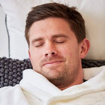 model wearing the clear nasal dilator while sleeping