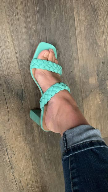 another reviewer wearing the aqua sandals