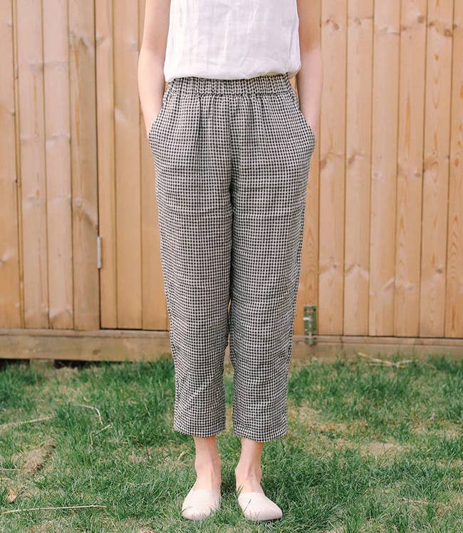 model wearing the black and white plaid pants