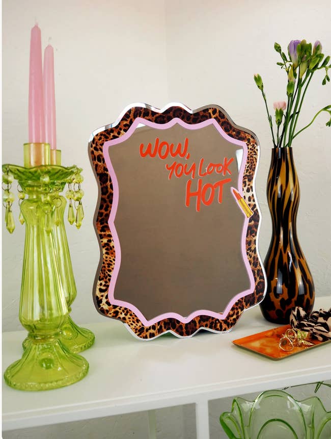 A stylish vanity setup featuring a reflector with