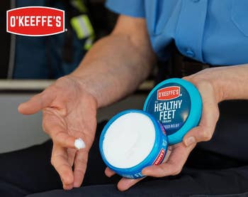 model holding unfastened jar of ft cream