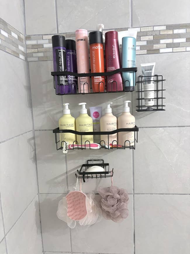 Shower caddy with assorted haircare bottles and bath accessories, including shampoos, conditioners, and loofahs. Perfect for organizing a bathroom