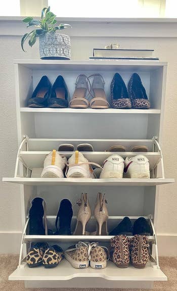 reviewer's white cabinet with shoes inside