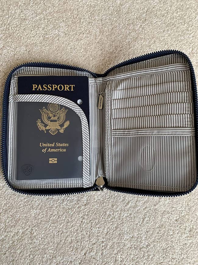 reviewer photo of open zip passport holder