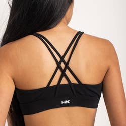 criss-cross detailing on the back of the swim top