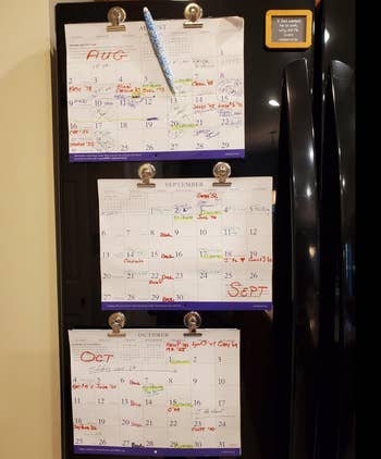 Reviewer fridge with calendar pages magnetized to the door by the clips 