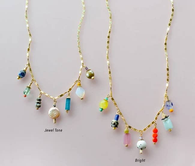 two charm necklaces in different color schemes — one jewel tone and one bright