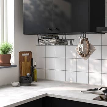 Rack attached beneath cabinets