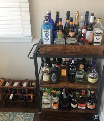 Reviewer image of the bar cart filled with bottles