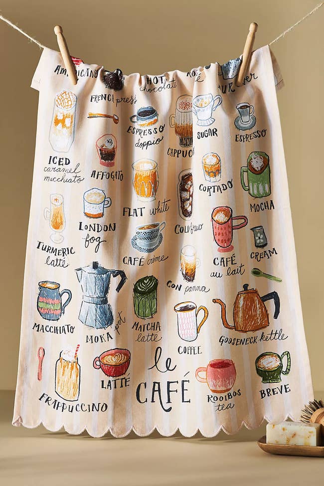 a dish towel covered in a variety of coffee-themed items and drinks