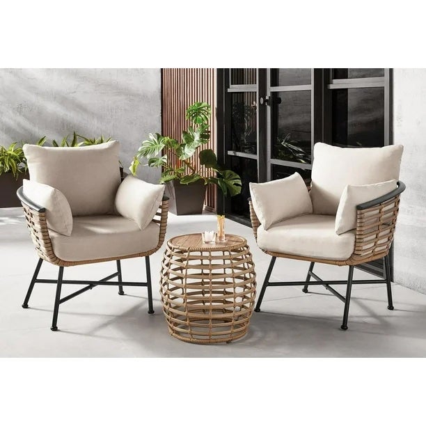 two patio chairs around a wicker small table