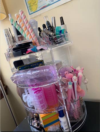 Reviewer's makeup holder full of products 
