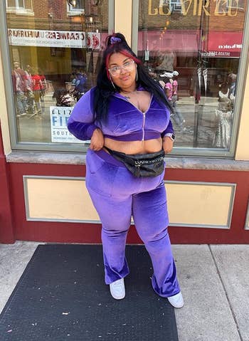 reviewer wearing the velour tracksuit in purple