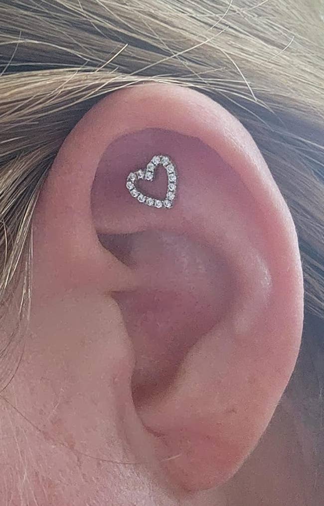 close of reviewers heart earring in their ear