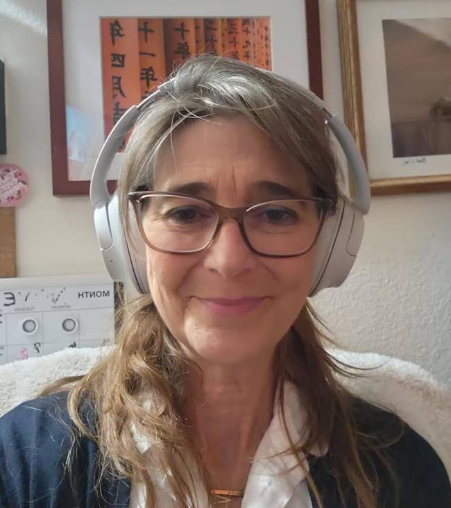 reviewer wearing headphones